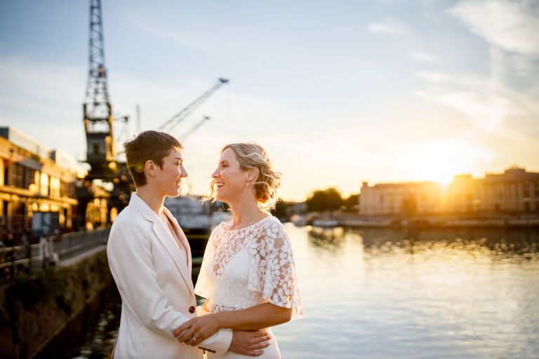 Couple at Bristol harbourside by cranes golden hour wedding photo