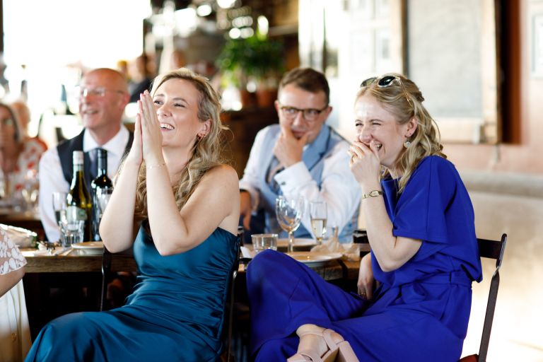 Family laugh at speech Bristol wedding