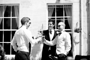 groom and ushers toasting
