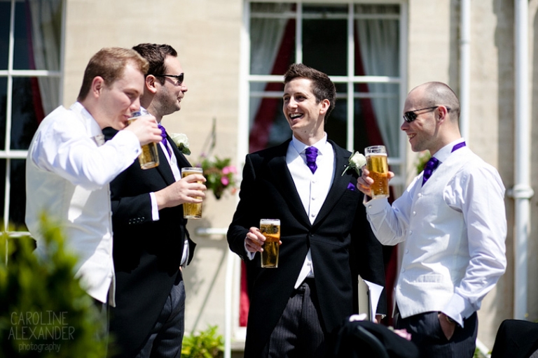 groom and ushers laughing