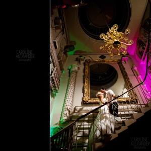 couple portrait on stair case at Aynhoe Park