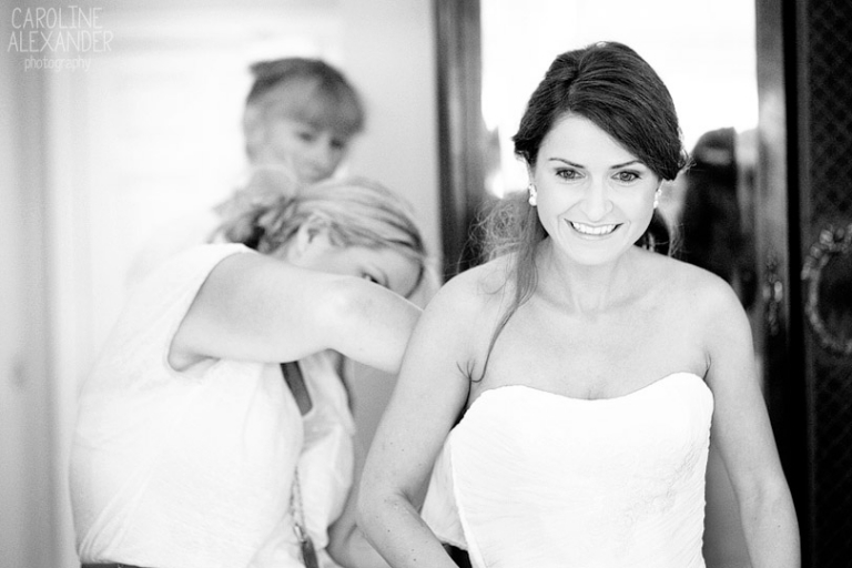 bride getting into dress at Barton House