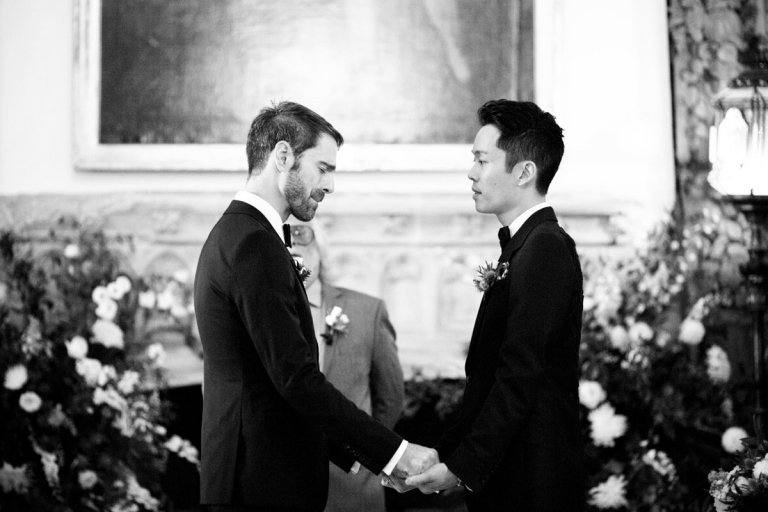 Berkeley Castle Wedding - One groom gets emotional during wedding ceremony while second groom says vows