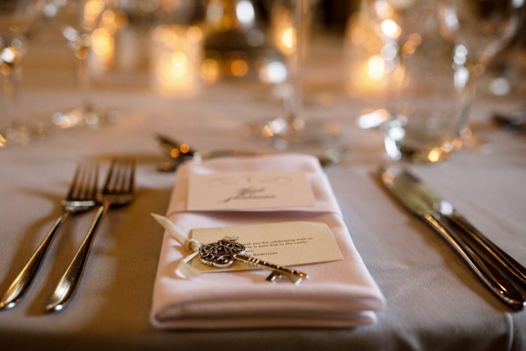 Berkeley Castle Wedding - table setting, napkin with a key and message