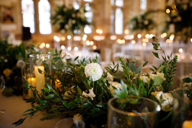 top table flowers with green foliage, white dahlias and candles 