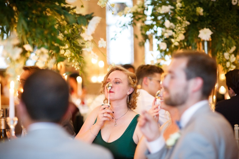 Berkeley Castle Wedding - wedding guests rests spoon on nose