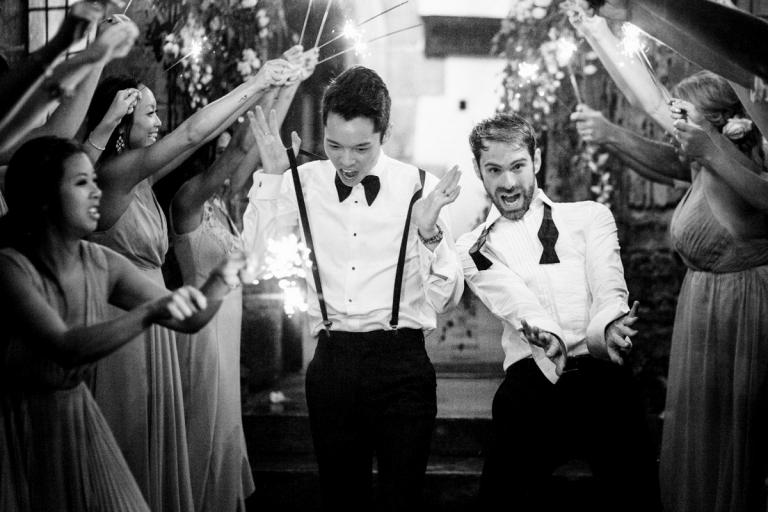 Berkeley Castle Wedding - two grooms dance between sparklers