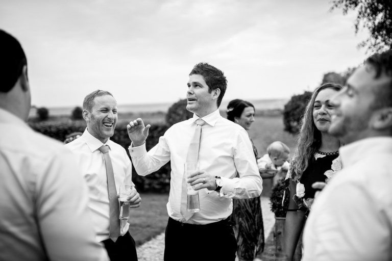 Guests laughing at wedding at Cripps Stone Barn