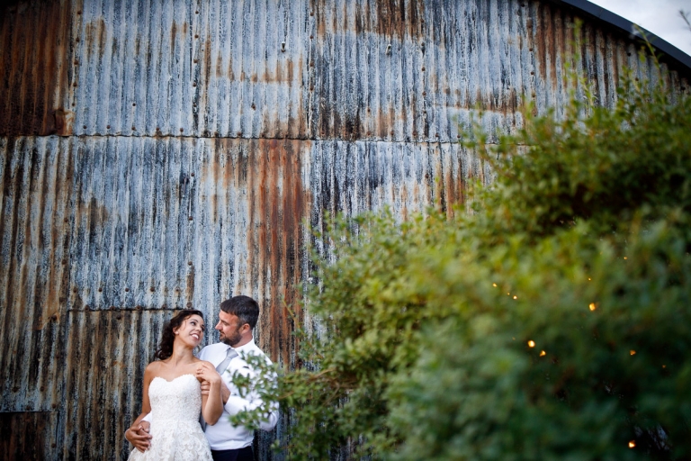 Couple look at each other in cripps stone barn wedding photos