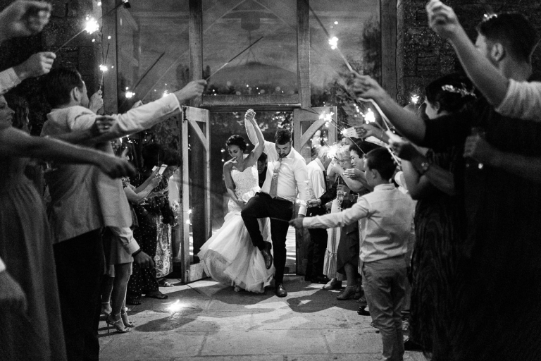 Sparkler exit at Cripps stone barn in black and white