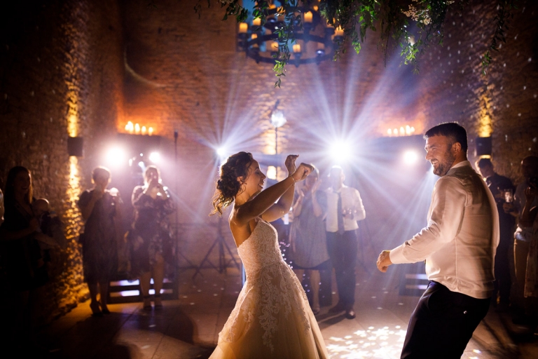 first dance with cool lighting at Cripps stone barn wedding photos
