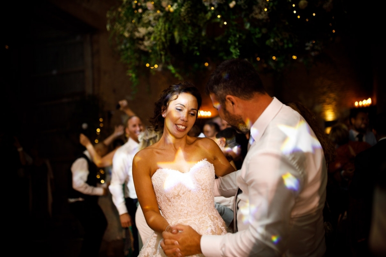 bride and groom dance with star light hitting them at cripps stone barn