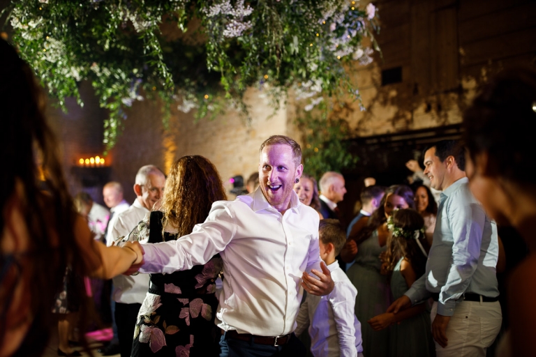 groomsmen dance at wedding at cripps stone barn
