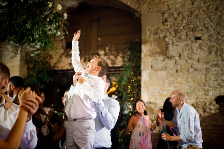 Kids is lifted in air at cripps barn stone wedding