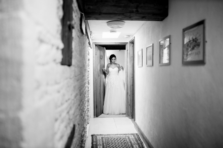 bride getting ready before wedding at stone barn