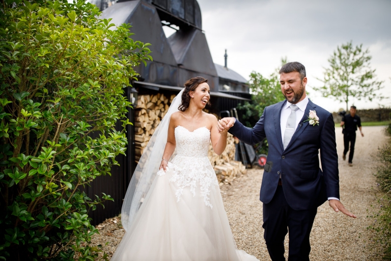 Couple show delight after just getting married at Cripps Stone Barn