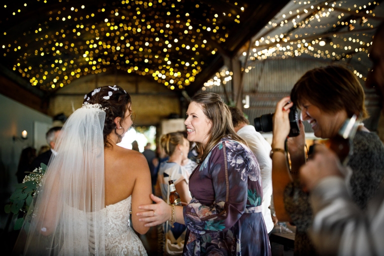 Guest congratulate bride with at Cripps Stone Barn