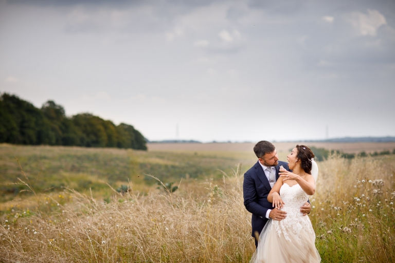 Couple laughing in cripps barn stone barn wedding photos