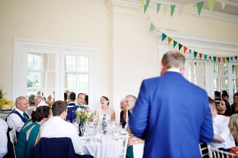 The top table all laugh at the best mans speech at wedding in clifton bristol