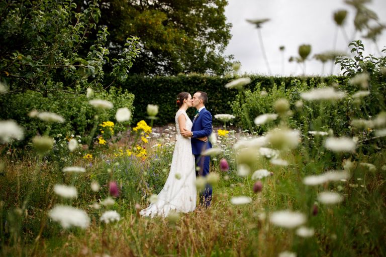 couple kissing in the flowers in the gardens at goldney hall