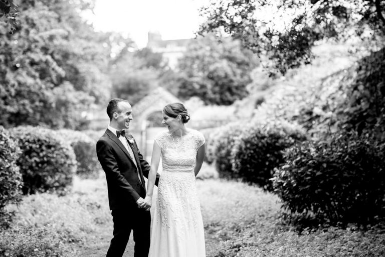couple laugh in the wild garden at goldney hall