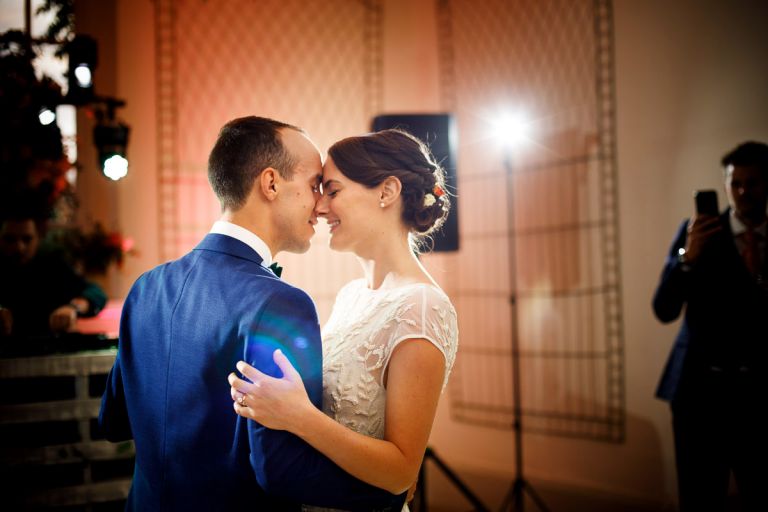 first dance with lens flare at bristol wedding, couple embrace and have an intimate moment
