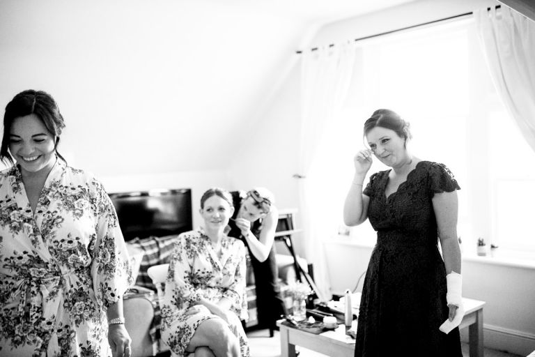 bridesmaids get emotional seeing the bride in her dress for the first time