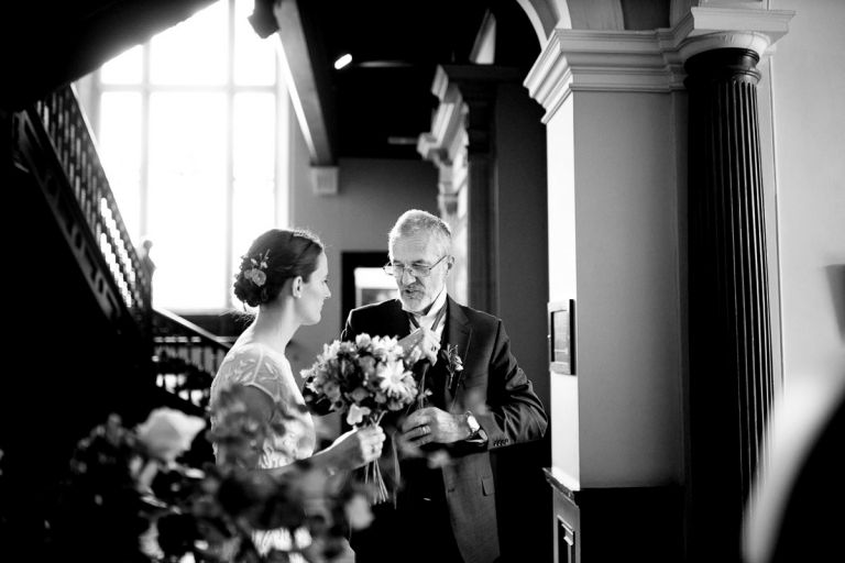 father of the bride puts his tie on in goldney house