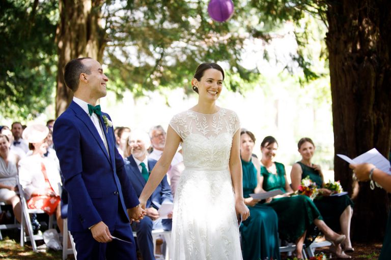 couple hold hands during their humanist ceremony at goldney house bristol