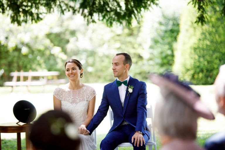 couple smile during wedding ceremony outdoors in bristol