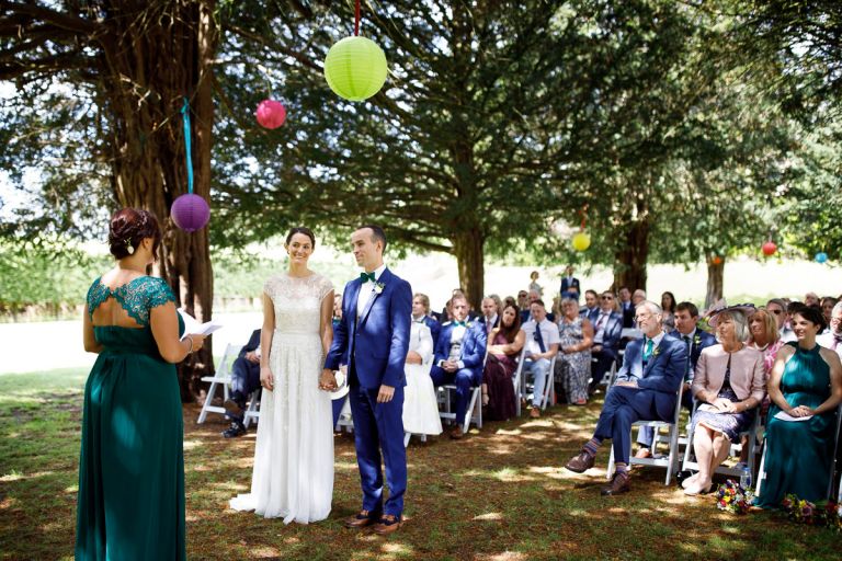 Couple about to say their vows during outdoor wedding ceremony at goldney hall clifton