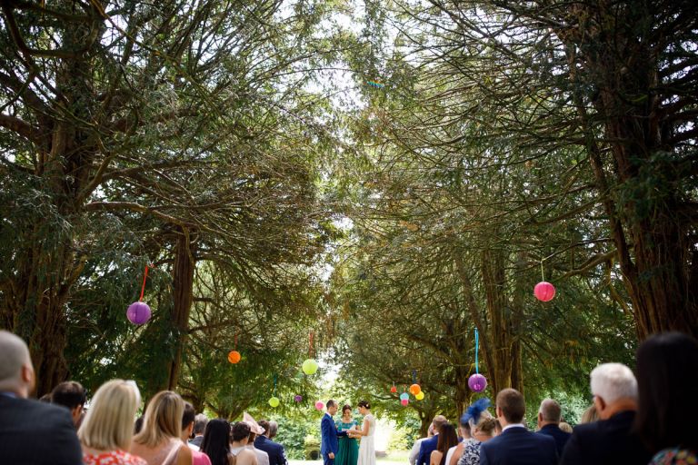 Wide view of the trees in the garden of goldney hall, perfect setting for this outside wedding ceremony