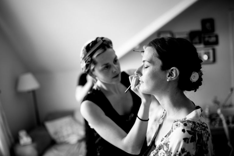 bride having her make up done professionally in cotham bristol before wedding at goldney hall