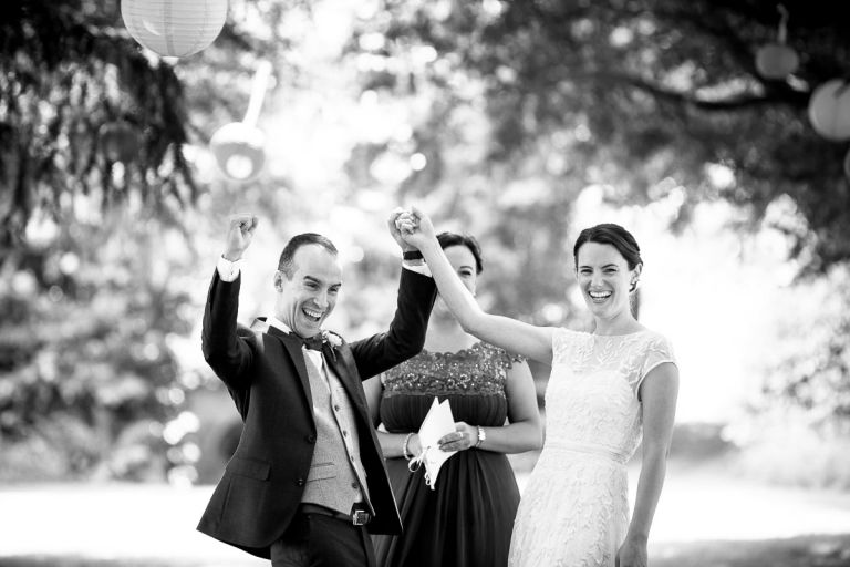 bride and groom elated after getting married outside at goldney hall