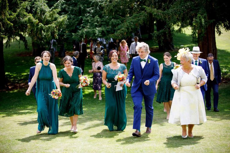 Wedding party getting ready for confetti at goldney house