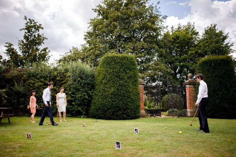 Guests play crochet outside at wedding in bristol