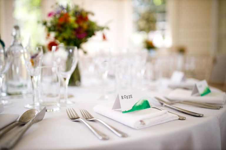 Close up of the brides placename and decorations in the orangery at goldney hall