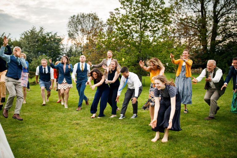 Guests get lively during dancing at humanist outside wedding