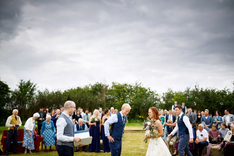 Bride and groom are together for the first time during their ceremony at their outdoor ceremony