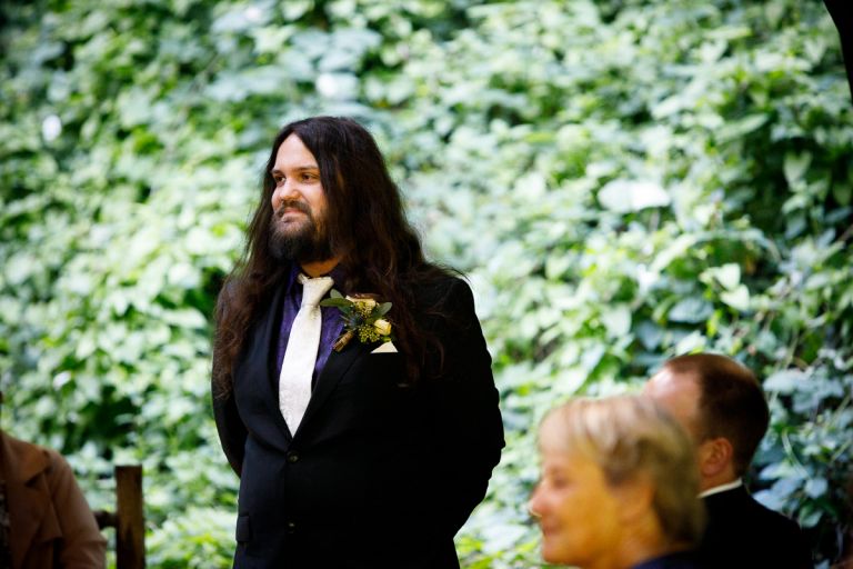 Groom waits for his bride's arrival in a forest in Bristol