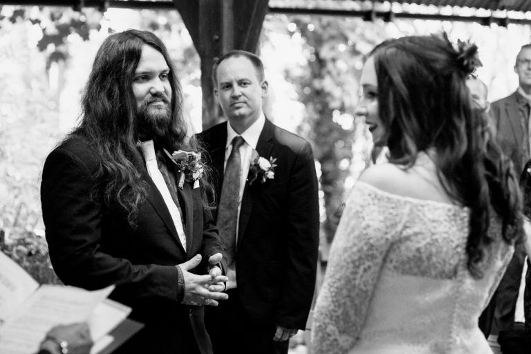 groom looks at his bride during their arnos vale wedding ceremony 
