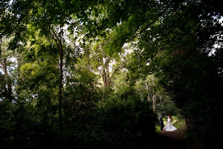 Couple dancing in the forest at their wedding in Bristol