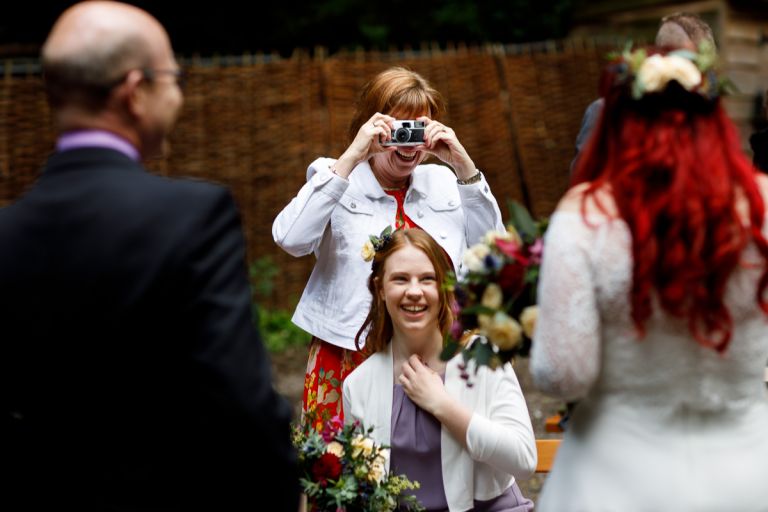 Guest takes photo of bride at arnos vale wedding