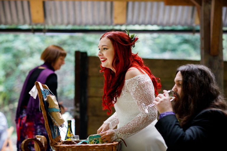 bride unpacks her picnic at anros vale wedding