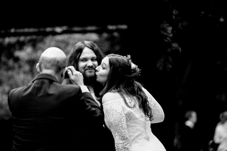 Bride kisses groom for photo arnos vale wedding photos