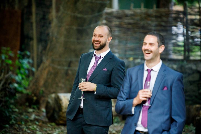 Guests react to speeches outdoors at arnos vale wedding photos
