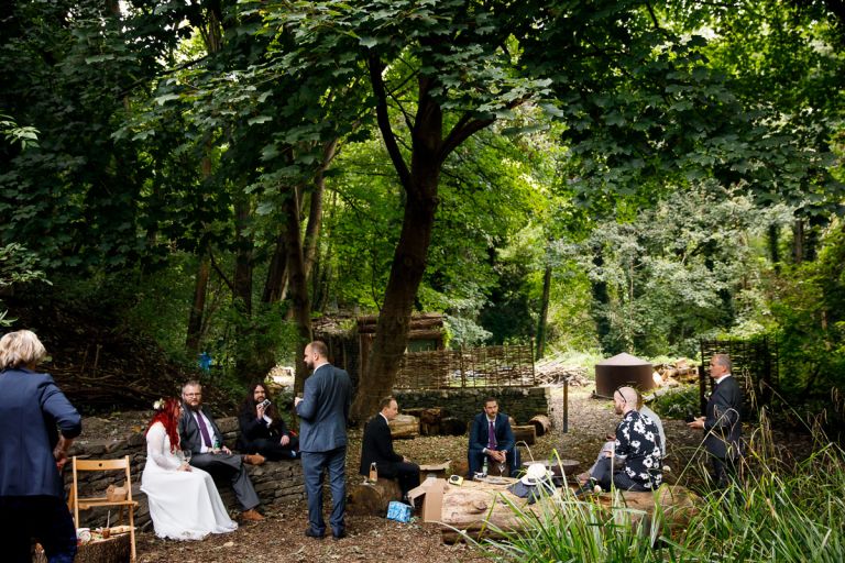 Guests hanging out at Bristol forest wedding