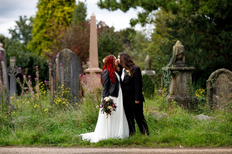 Arnos Vale wedding photos couple kiss in cemetery in Bristol.