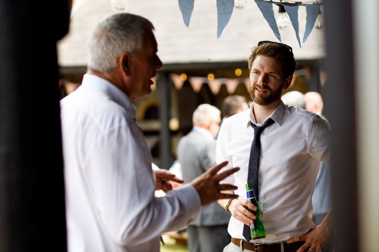 Chatting Guests at Barn wedding 