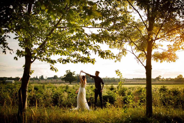 Couple dance in the trees during wedding Gloucester The Over Barn